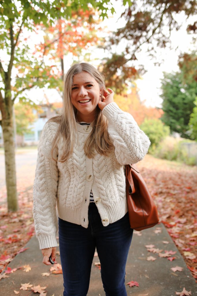 You'll love fall in this cozy fall outfit. A chunky knit sweater is ideal for when the temperature dips below 60 degrees. Get all the details of this easy fall outfit by clicking through or save if for fall outfit inspiration later #fallfashion #falloutfitidea