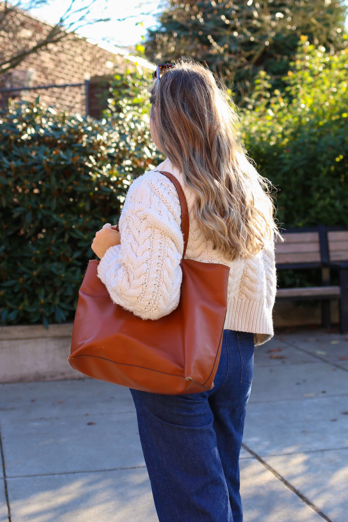 The Old Navy flannels are a great affordable find. This is an easy plaid flannel outfit idea for the fall and winter. With a cable knit cardigan and jeans, you'll have a perfect preppy flannel outfit for winter. #preppy #winteroutfitidea #flannel